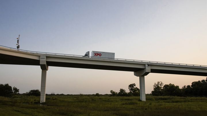 XPO truck on a bridge