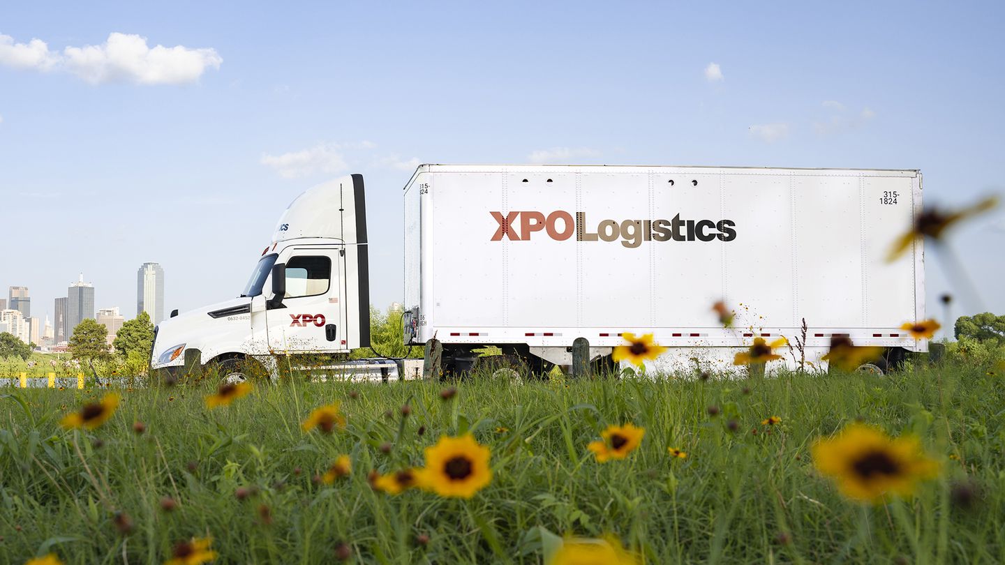 XPO truck with sunflowers in the foreground